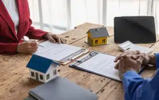 Two landlords going through a checklist for leasing your first rental property